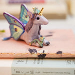 Unicorn with little dragons figurine