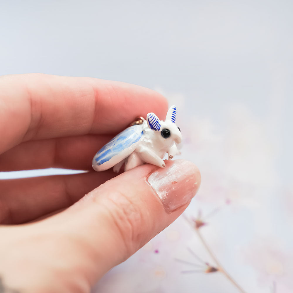 Blue fluffy moth pendant