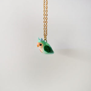 Lovebird with fruit pendant
