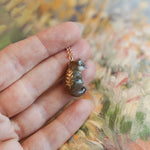 Weasel with a fern pendant