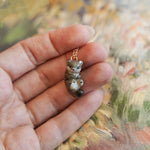 Weasel with a fern pendant