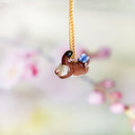 Weasel in the meadow pendant