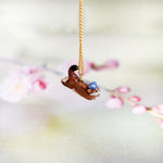 Weasel in the meadow pendant