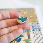 Whale with a star pendant