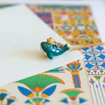 Whale with a star pendant