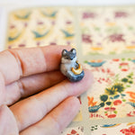 Wolf with a gold moon pendant