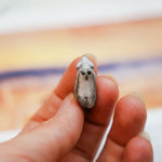 Wolf with a silver moon pendant