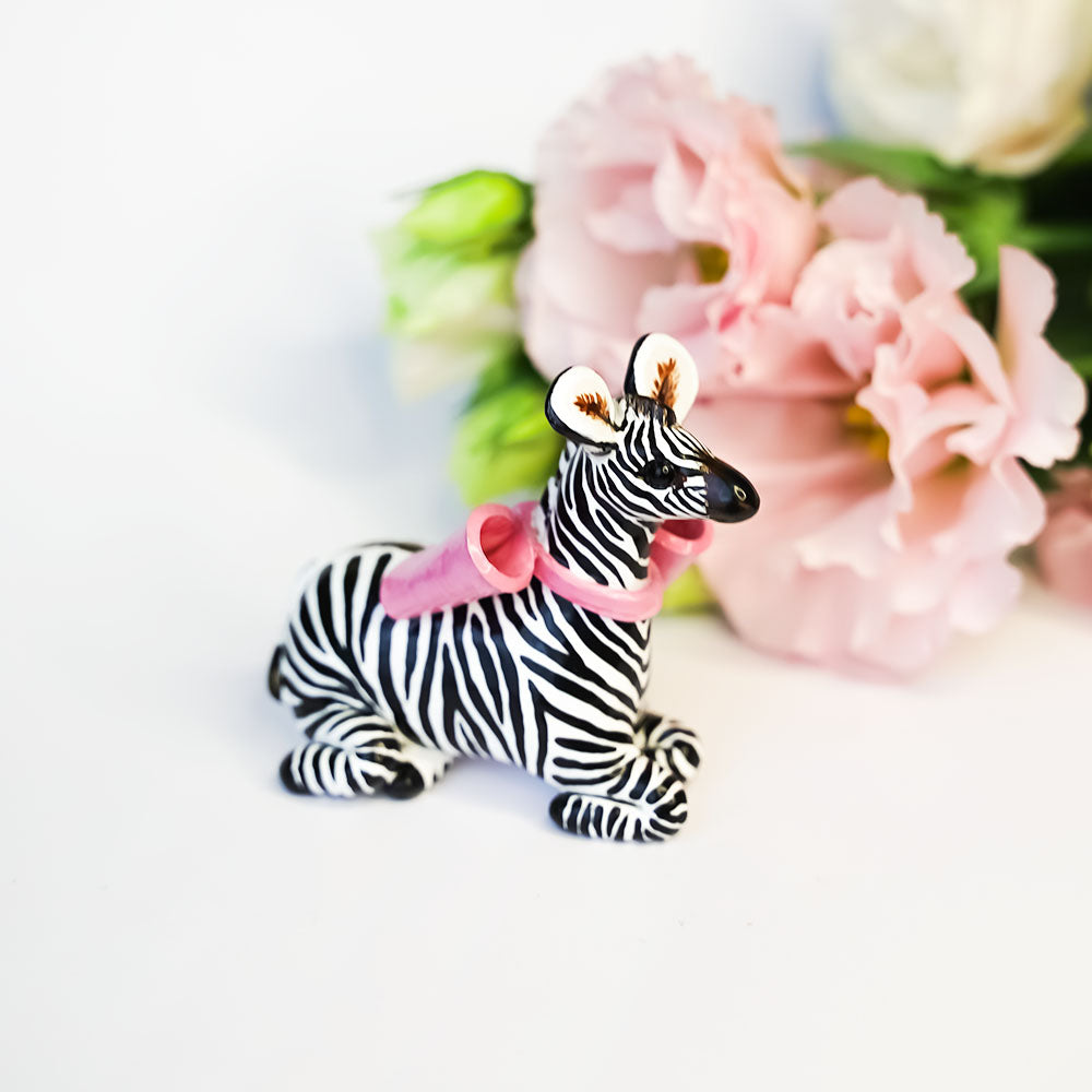 Zebra with a pink bow