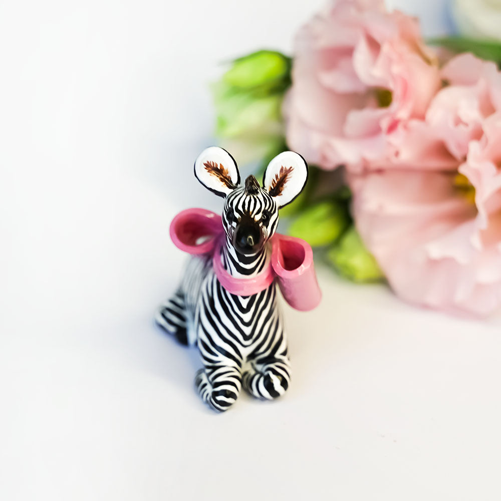 Zebra with a pink bow