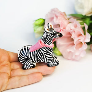 Zebra with a pink bow