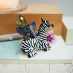 Baby zebra and Elephant figurine