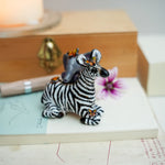 Baby zebra and Elephant figurine