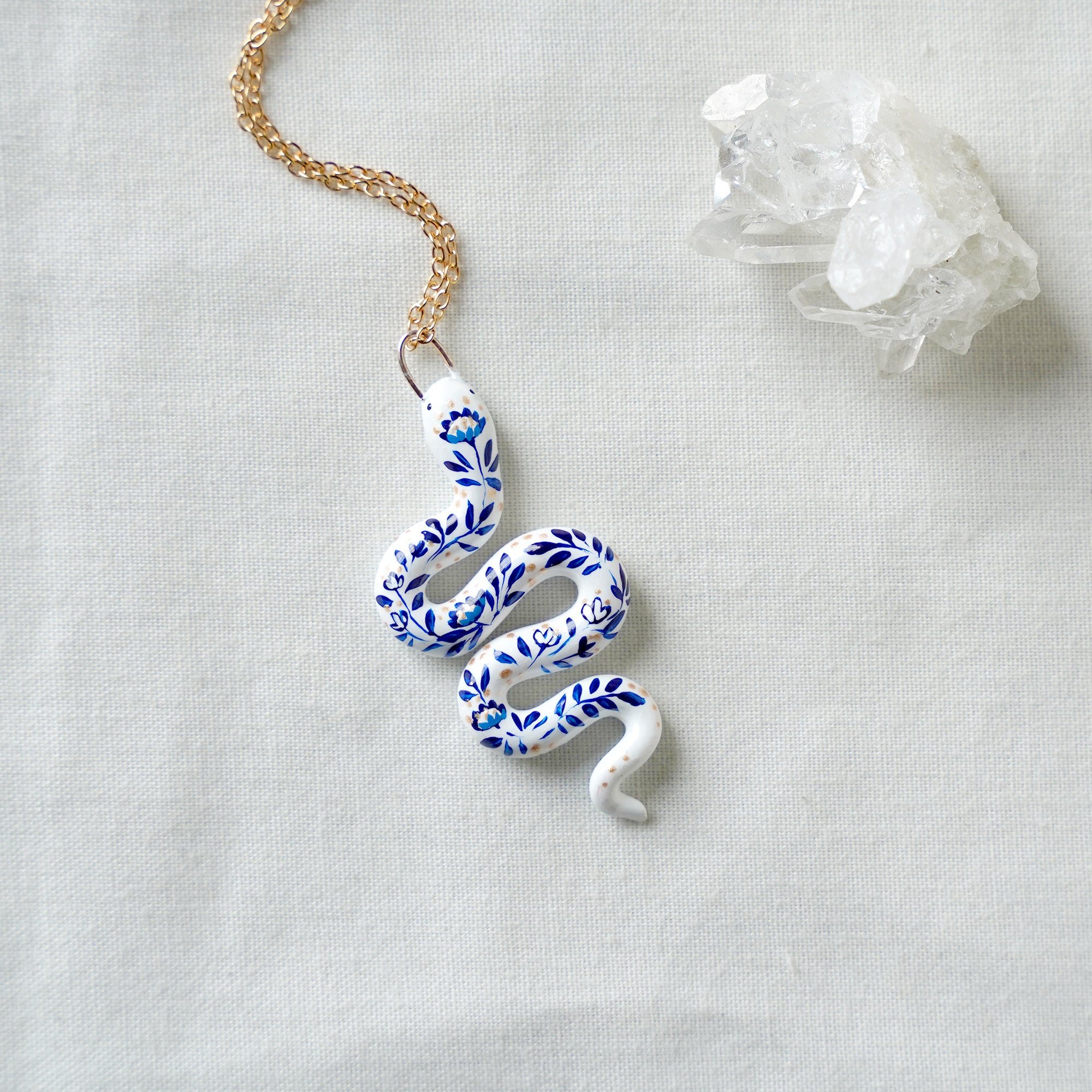 Snake with blue flowers necklace