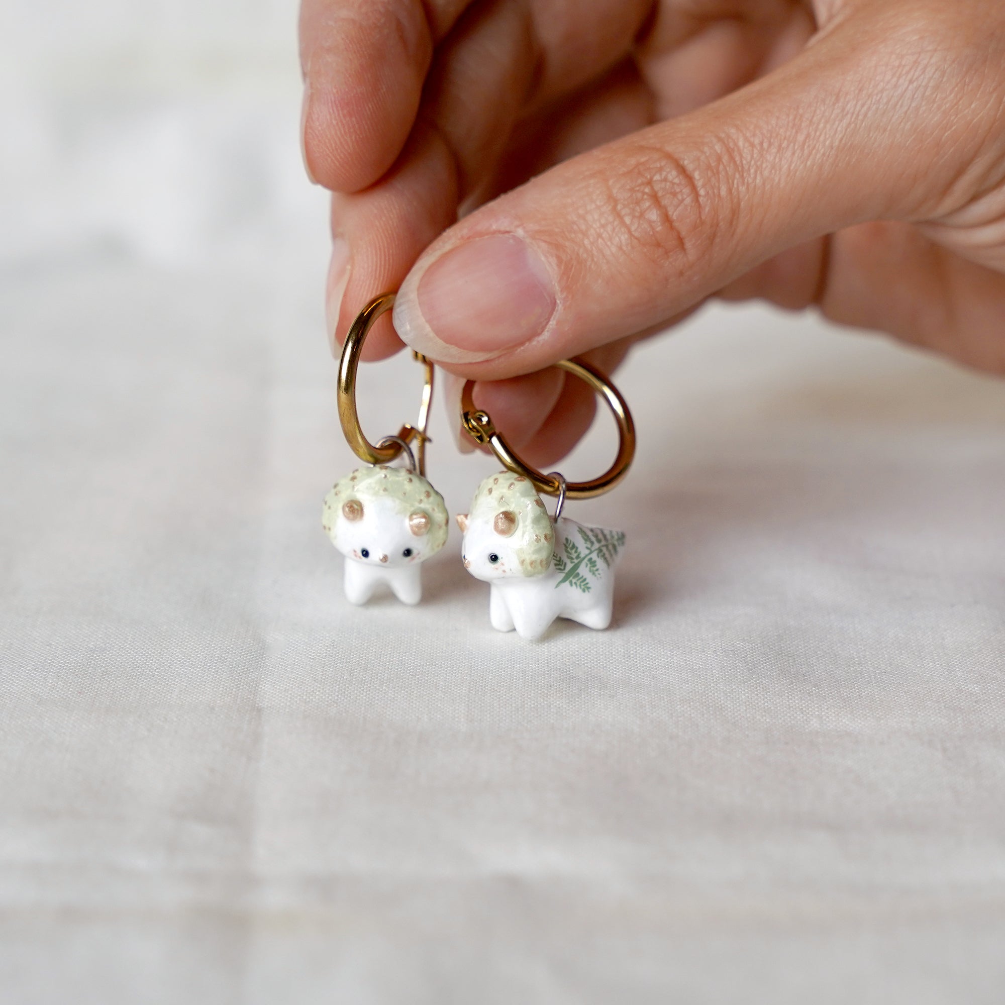 Triceratops with fern earrings