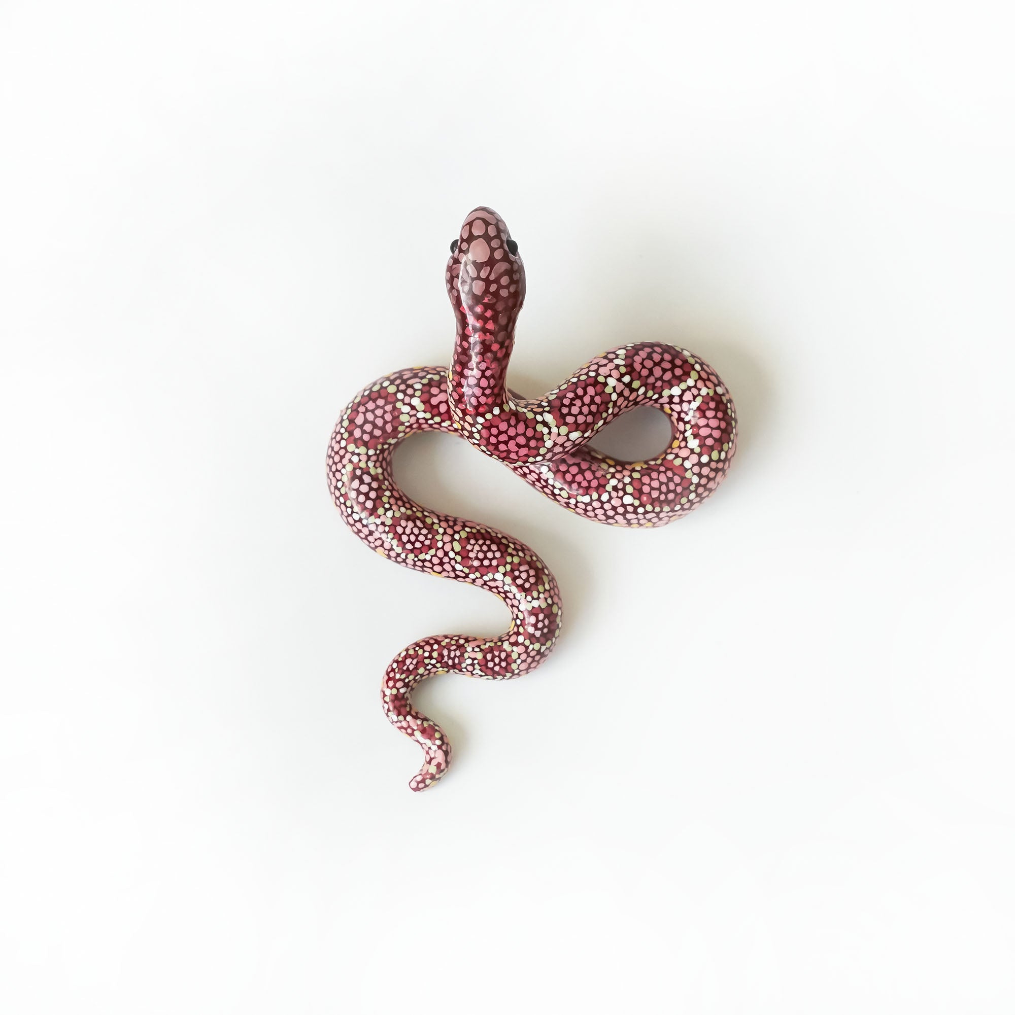 Maroon snake figurine