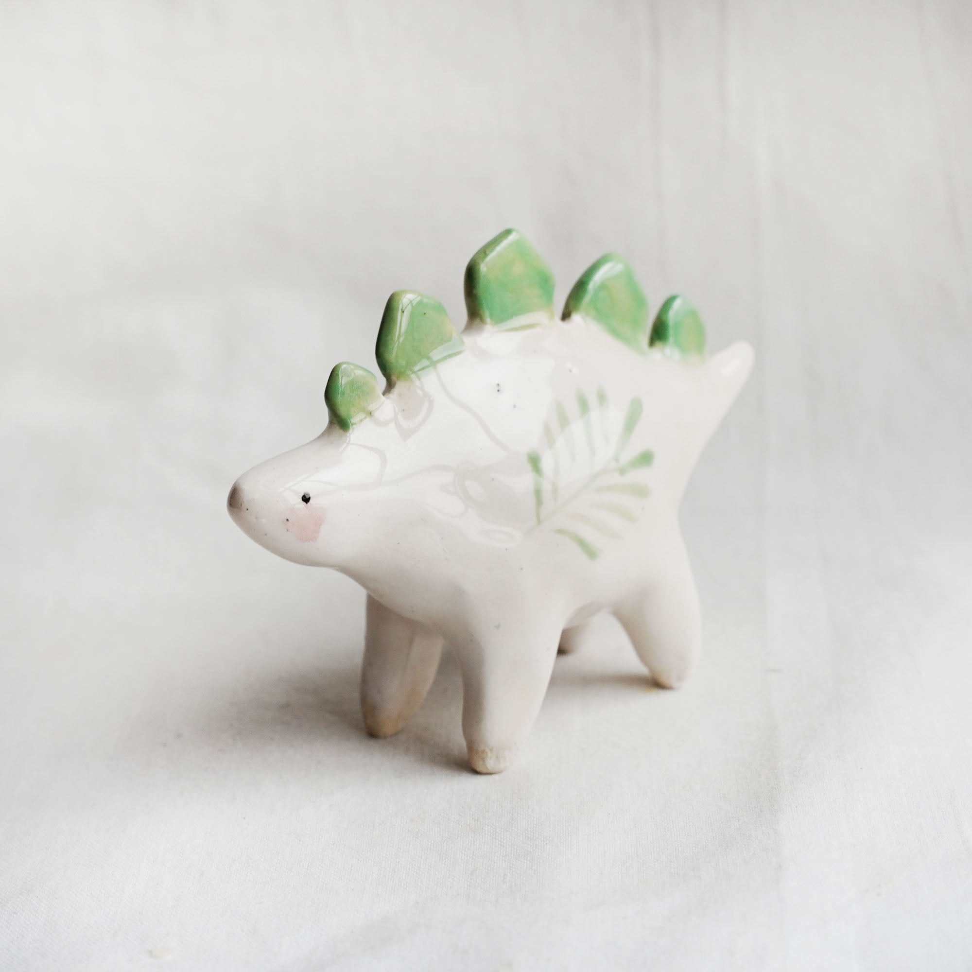 Ceramic stegosaurus figurine
