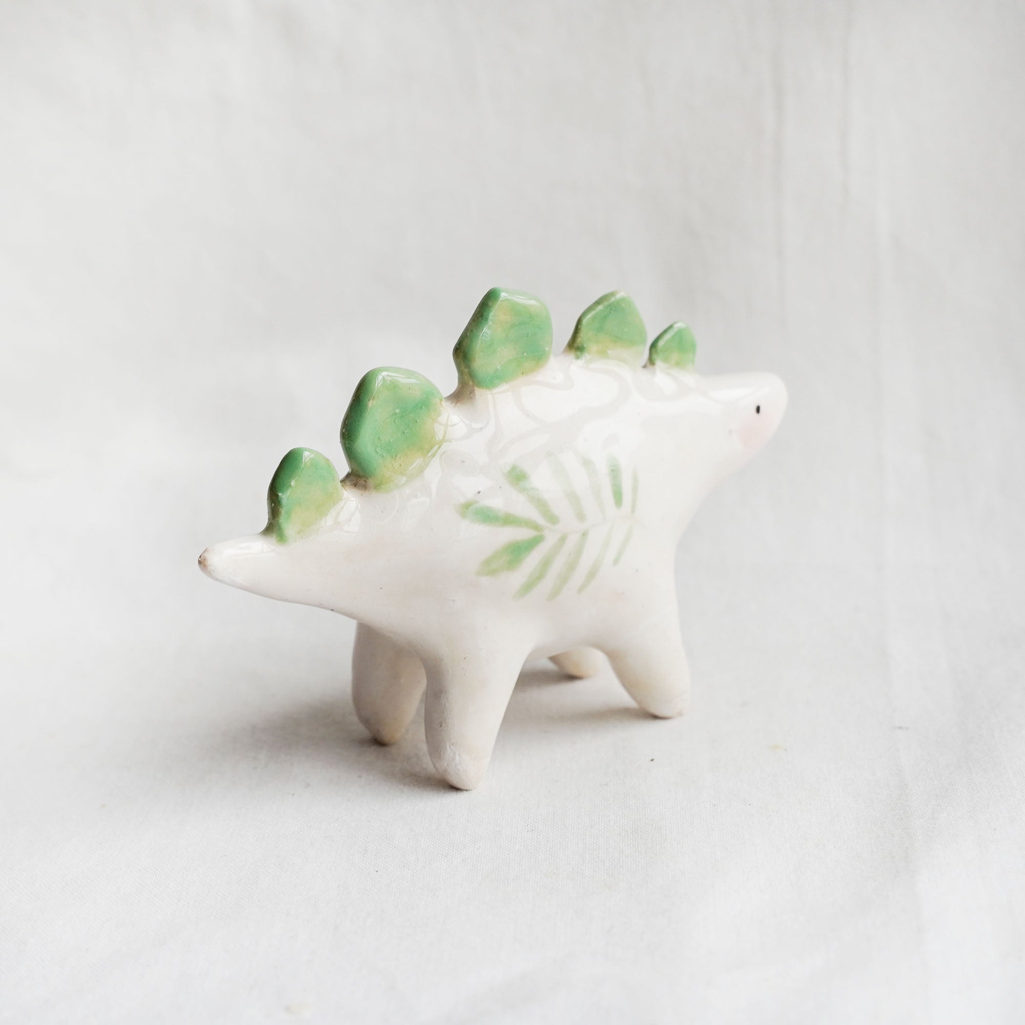 Ceramic stegosaurus figurine