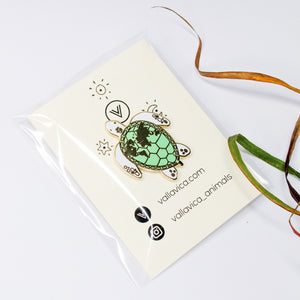 Enamel pin sea turtle with world map