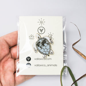 Enamel pin sea turtle with world map