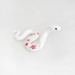 White snake with pink flowers figurine